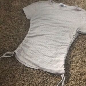 Form fitting top with strings for bows at sides